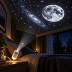 White galaxy projector on a bedside table projecting a full moon, spiral galaxy and stars onto the bedroom ceiling
