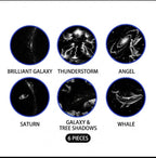A collection of 6 themed projector slides including Brilliant Galaxy, Thunderstorm, Angel, Saturn, Galaxy & Tree Shadows, and Whale from Dreams Setup.