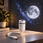 Mini white USB galaxy projector on a desk projecting a full moon and starry sky onto the wall, beside a plant and books
