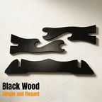 A professional wall-mounted display of a tactical white and black crossbow in a modern room, featuring a wooden slatted wall and elegant interior decor from Dreams Setup.