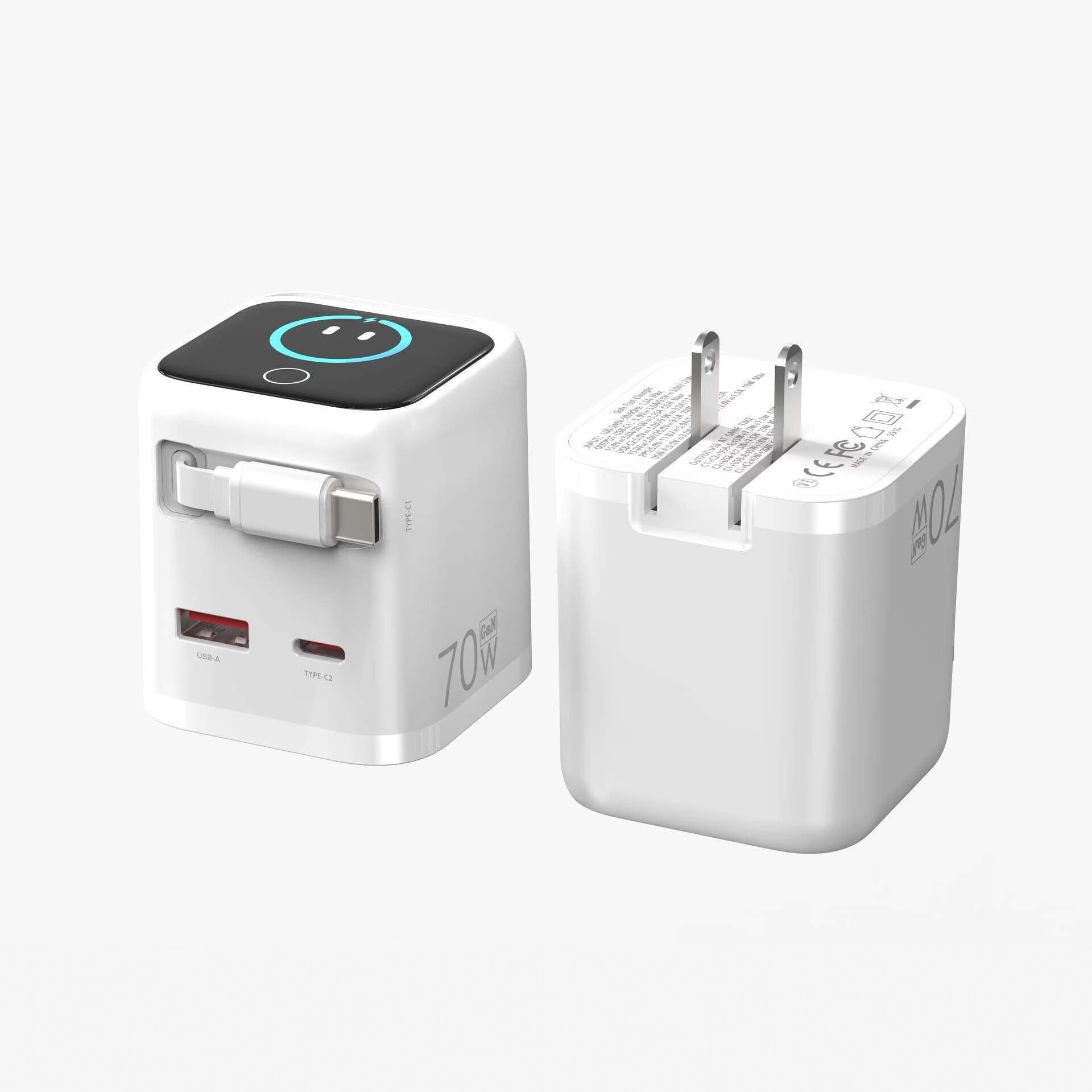 Compact white 70W GaN fast charger from Dreams Setup with a foldable plug design and integrated USB-C cable for easy travel.